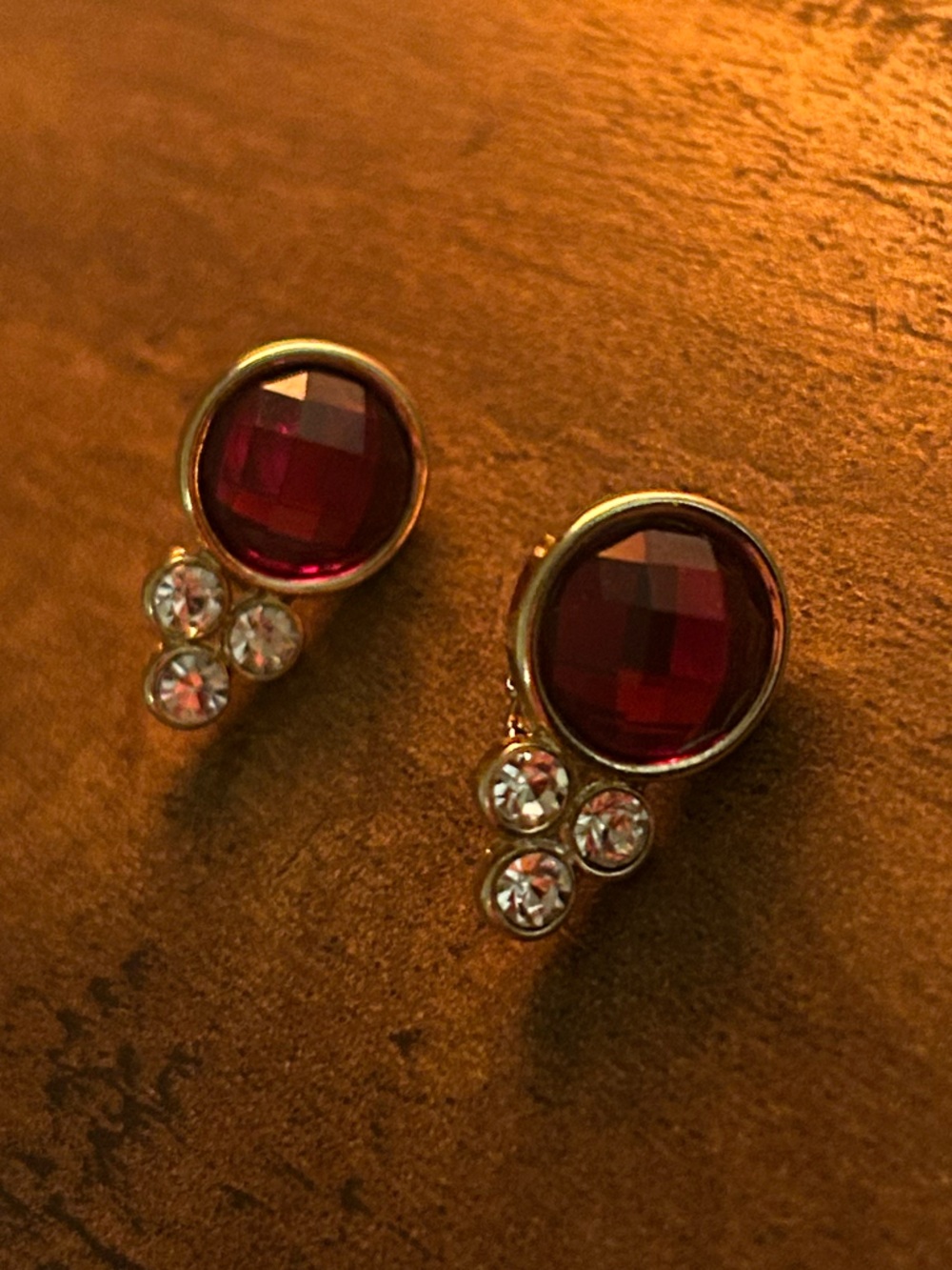 Gold Clip-On Earrings with Deep Red Gemstones and Clear Accents